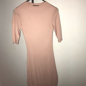 Salmon colored knee length fitted dress